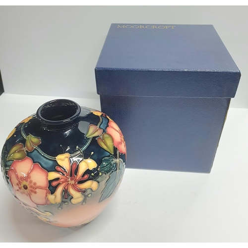 109 - Moorcroft bulbus vase c1990s with original box,

18cm tall