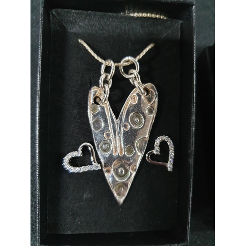 26 - 925 silver Unicorn pendant on silver chain together with a large silver heart pendant on silver chai... 