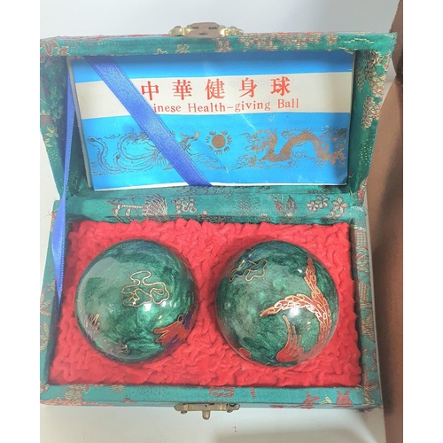 37 - Oriental styled jewellery box and contents together with a pair of cased Oriental wellness balls (Qt... 