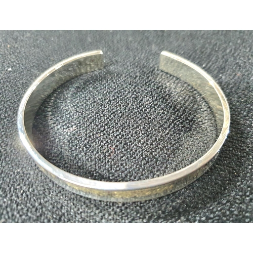 25 - Silver golfing pin dish together with an engraved silver bangle in its own presentation box and a si... 