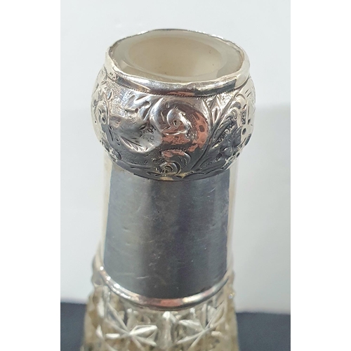 427 - Silver coloured, antique cut-glass perfume bottle