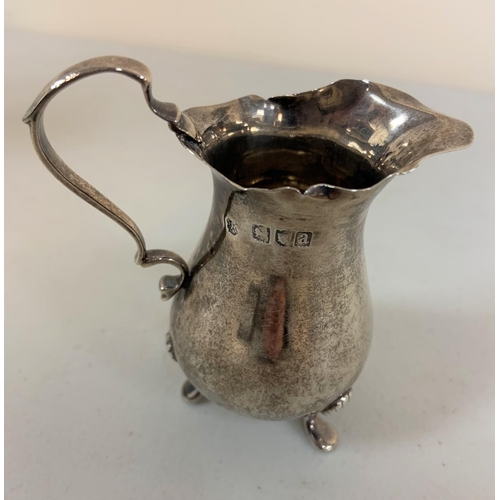 10 - Victorian silver pad foot cream jug, London 1896,

58.5 grams