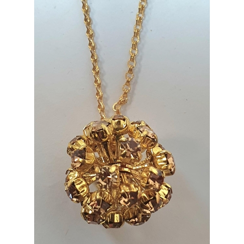 29 - Fine, long  9ct fine gold chain with plastic 3-d circular pendent,

7.2 grams gross         chain ap... 