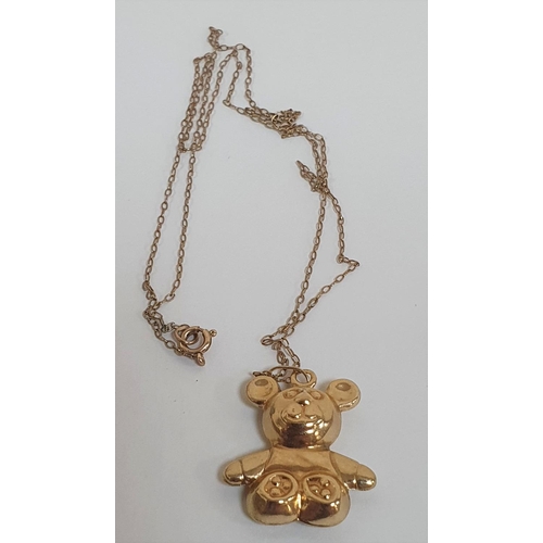 34 - 9ct gold Teddy pendent on a fine 9ct gold chain,

2.6 grams           48cm long