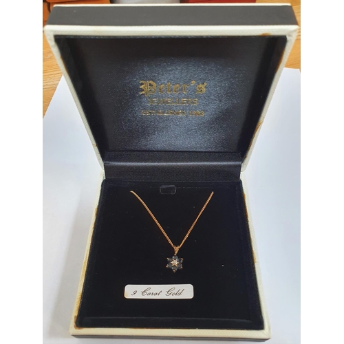 116 - 9ct fine gold chain with a flower pendant with a central illusion set diamond and six round cut Sapp... 