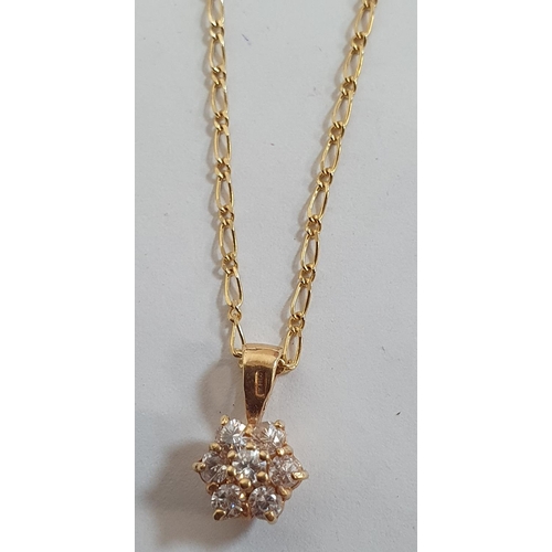 82 - Flower pattern diamond pendant consisting 7 round cut diamonds set into 9ct yellow gold and on a fin... 