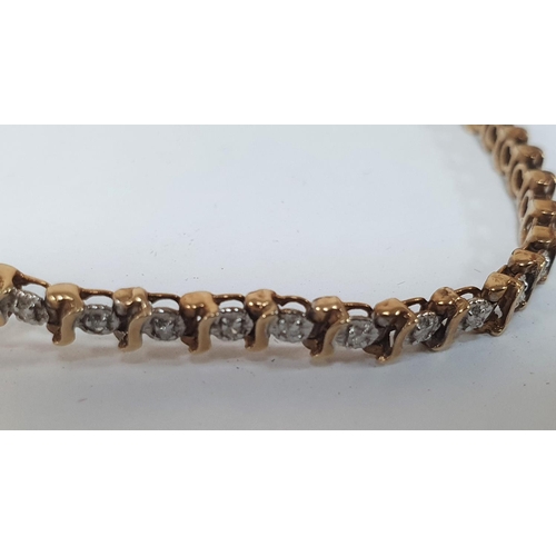 87 - 9ct gold bracelet inset with illusion set diamonds, total diamond weight - 0.25ct,

6.4 grams gross