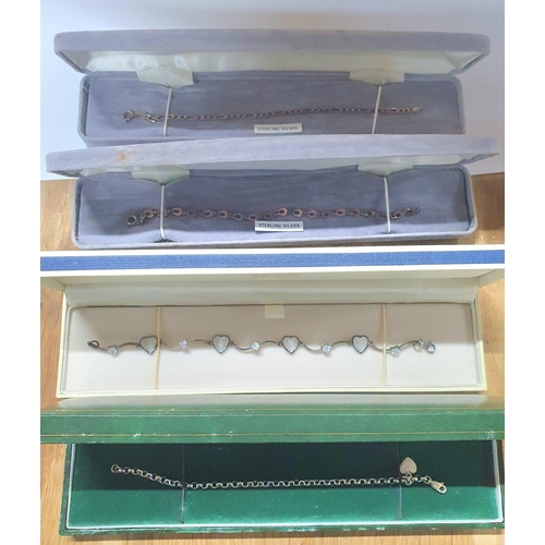 56 - Four silver bracelets, all as new and in their presentation boxes (4)