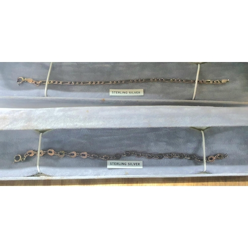 56 - Four silver bracelets, all as new and in their presentation boxes (4)