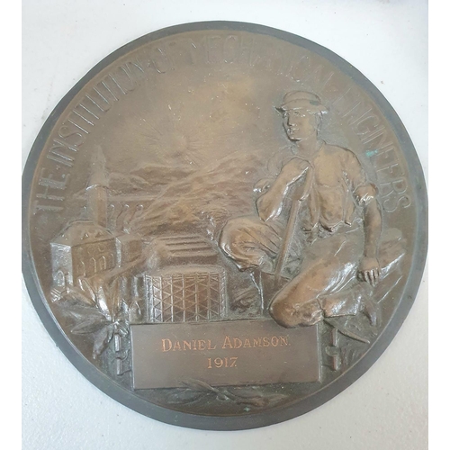 184 - A carved walnut barometer with thermometer together with a bronze circular 1917 plaque marked 