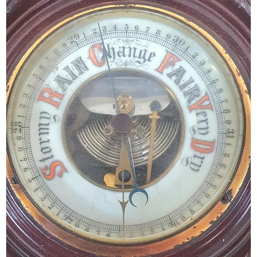 184 - A carved walnut barometer with thermometer together with a bronze circular 1917 plaque marked 