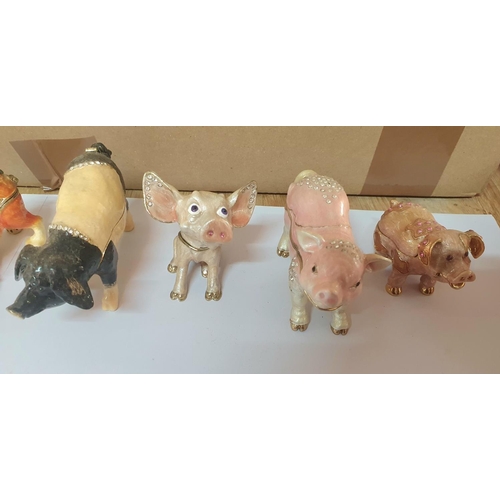 206 - Seven good quality enameled metal trinket/ring boxes in the form of Pigs and Cats (7)