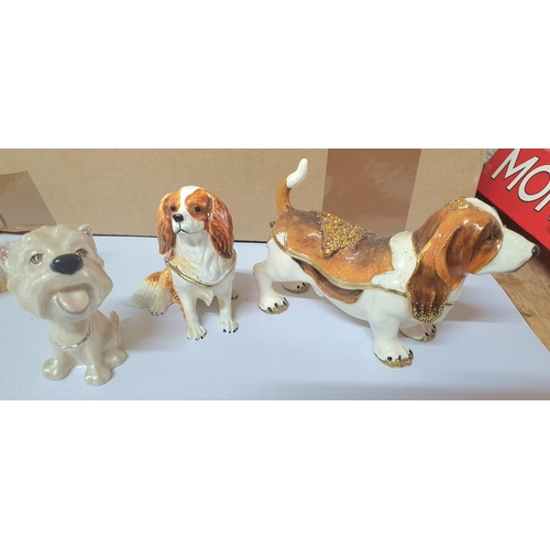 208 - Seven good quality enameled metal trinket/ring boxes in the form of Dog figurines (7)