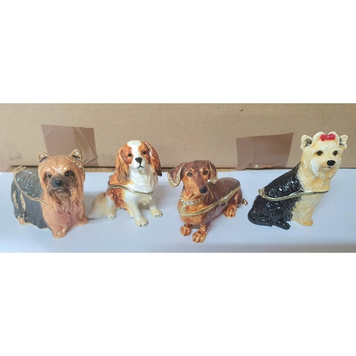 208 - Seven good quality enameled metal trinket/ring boxes in the form of Dog figurines (7)