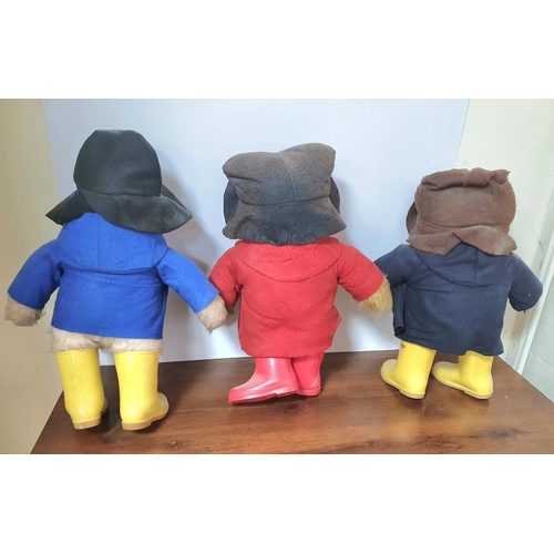 344 - Three large Paddington Bears in wellington boots (3)