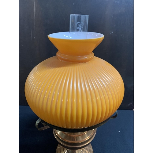 383 - Copper oil lamp with orange glass shade