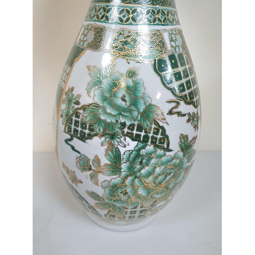 476 - Large green Oriental floor vase with patterned edge, marked to base,

47cm tall