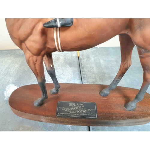 487 - Beswick connoisseur statue of Red Rum with jockey (Brian Fletcher) up, on wood plinth

Approx 32cm l... 