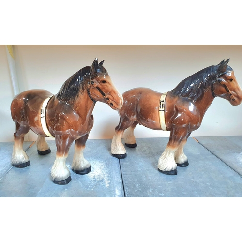 495 - Two large, vintage ceramic Shire, Drey horses (2)

Both approx 32cm long