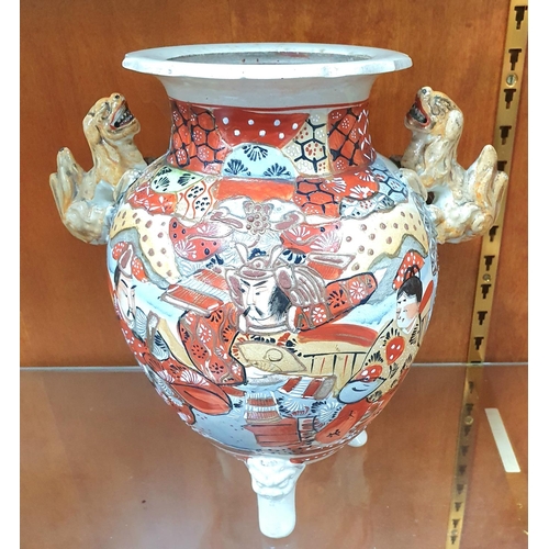 496 - 20thC Japanese Satsuma vase with Foo dog handles and tripod feet,

28cm tall