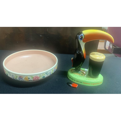 499 - Original Guinness Toucan (a/f) together with a Poole Pottery fruit bowl (2)