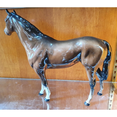 502 - Large Beswick glazed bay horse,

31cm high x 36cm long