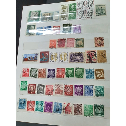 450 - Four stamp albums including a whole album of German, good collection of Japan, China and Hong Kong, ... 