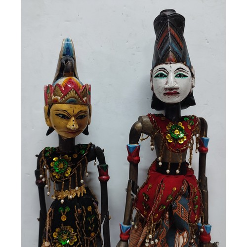 236 - Two Wayang Golek rod puppets seated on wooden bases (2)