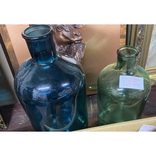 1072 - 2 large coloured glass bottles