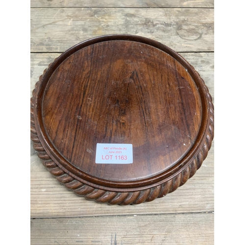 1163 - Old Mahogany circular vase stand on wheels