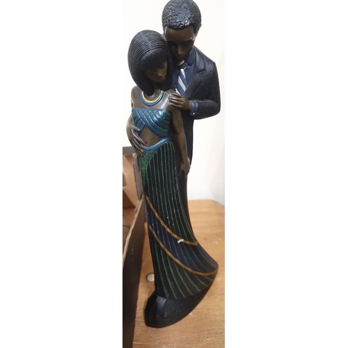 1240 - Tall, modern black man and lady figurine