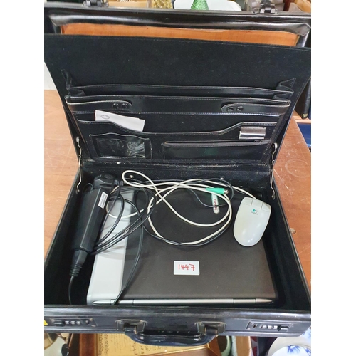 1447 - Briefcase containing a Compaq computer, mouse and leads