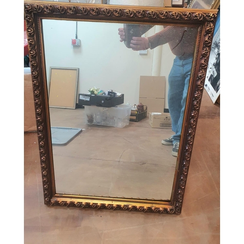 45 - Ornately framed mirror