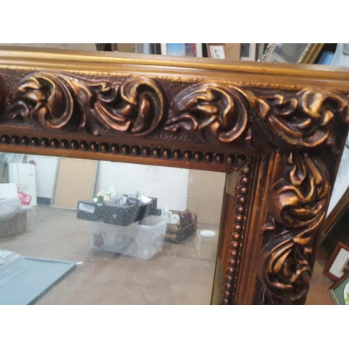 45 - Ornately framed mirror