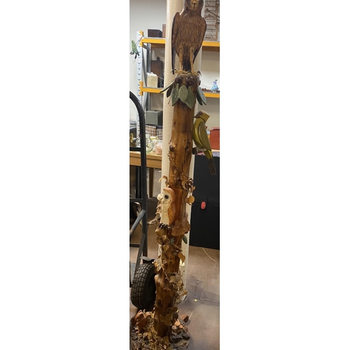 54 - Stunningly carved, mid 20thC, wooden pole with carved foliate and bird figurines,

Approx 1.3m tall