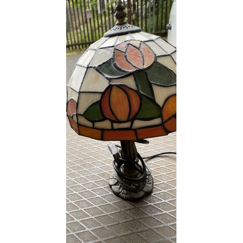 56 - Small ornately cast metal based Tiffany style table lamp