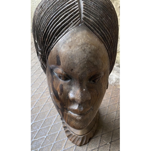 57 - Carved wooden head bust of an African lady