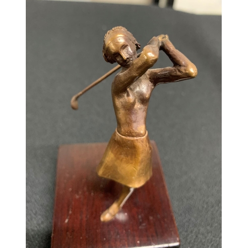 119 - Small unmarked modernist bronze of a lady golfer on a wooden plinth