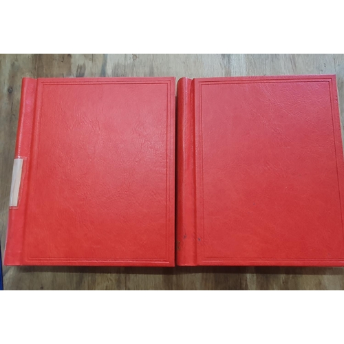 189 - Two red stamp albums to include QV Canada including a used 5d 1868 etc and a good quantity of China,... 