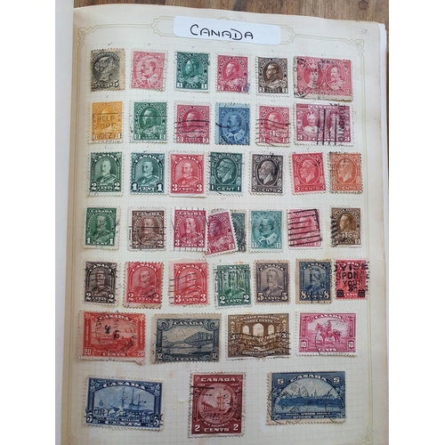 189 - Two red stamp albums to include QV Canada including a used 5d 1868 etc and a good quantity of China,... 