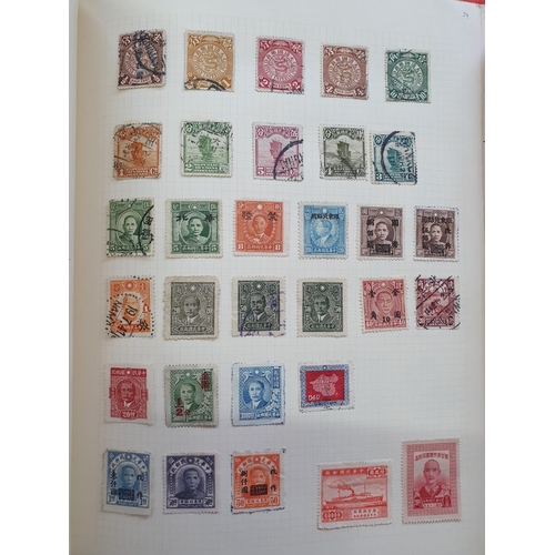 189 - Two red stamp albums to include QV Canada including a used 5d 1868 etc and a good quantity of China,... 