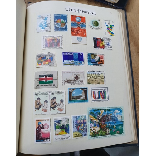 202 - Two world albums including thousands of world stamps, many Denmark, Finland, Greece, United Nations,... 