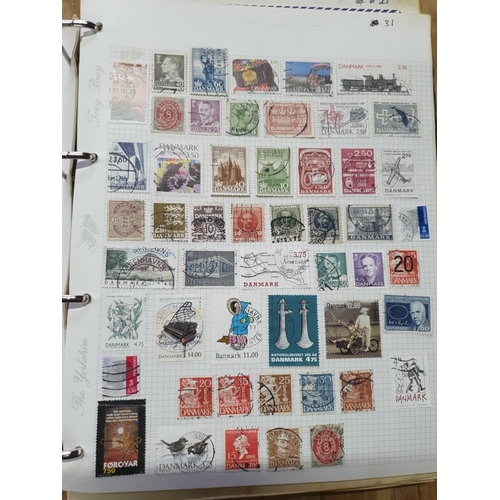 202 - Two world albums including thousands of world stamps, many Denmark, Finland, Greece, United Nations,... 