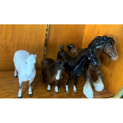 327 - Four Beswick horses including a solid black and solid white example (4)