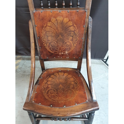 381 - Antique rocking chair with pokerwork decoration