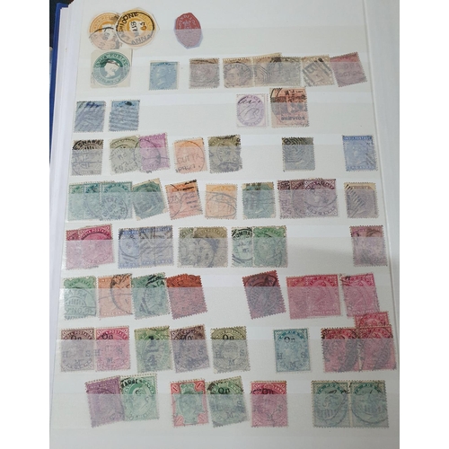 202 - Blue stamp album containing a large collection of used & mint stamps including 19thC India and Jamai... 