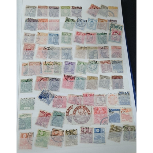 202 - Blue stamp album containing a large collection of used & mint stamps including 19thC India and Jamai... 