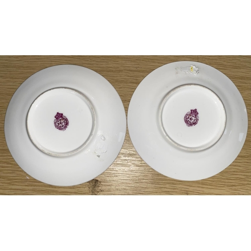 299 - Two Royal Worcester saucers and a similar two-handled blush vase (3)