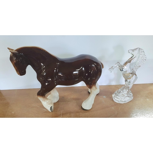 309 - Cut-glass model of oa rearing horse together with an unmarked oversized porcelain Shire horse (2)