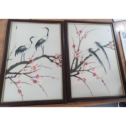 320 - Pair of Hong Kong watercolour on silk pictures depicting birds on a branch, both in matching frames ... 